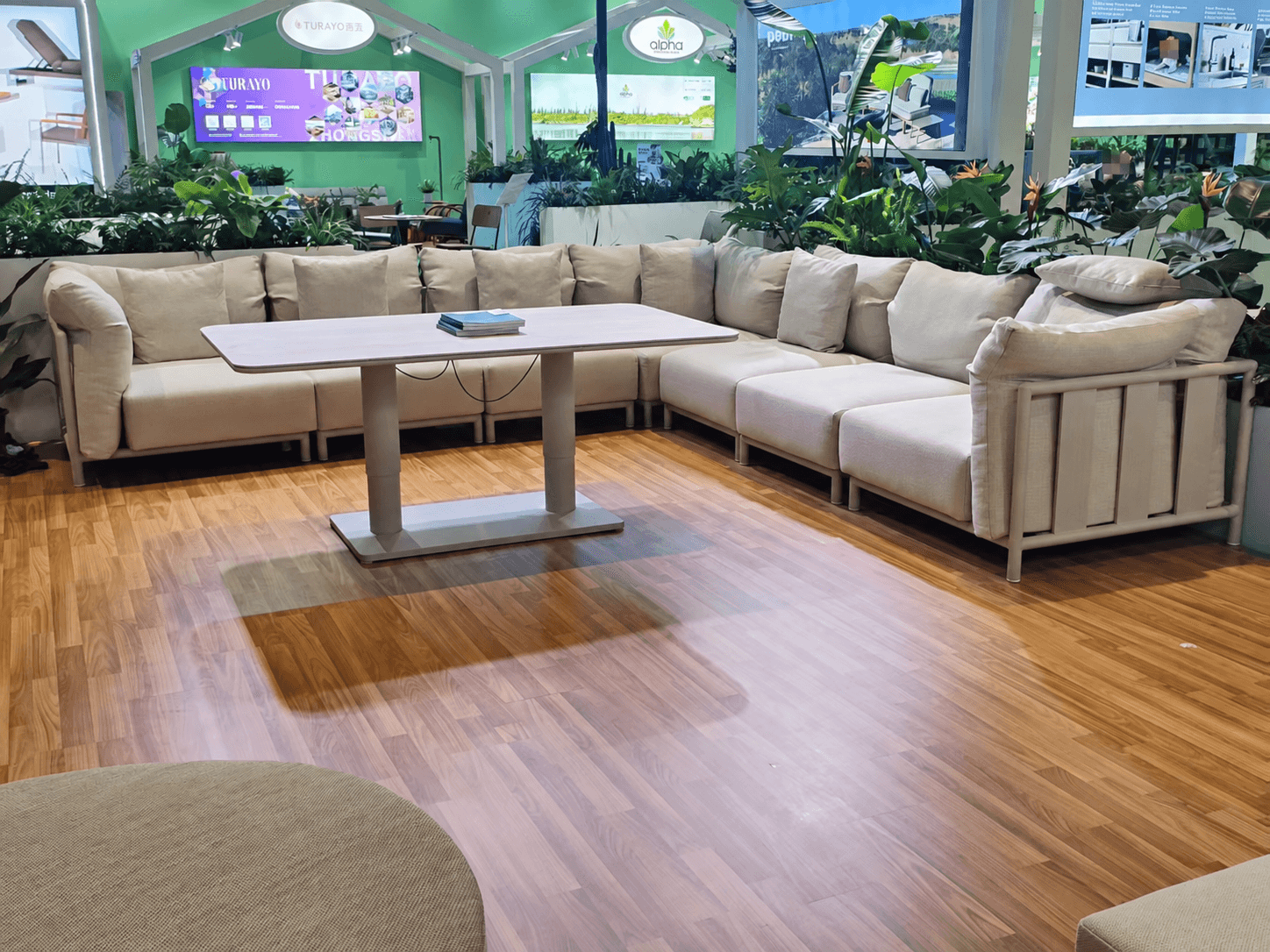 Outdoor corner sofa and table displayed at the Alomé exhibition booth