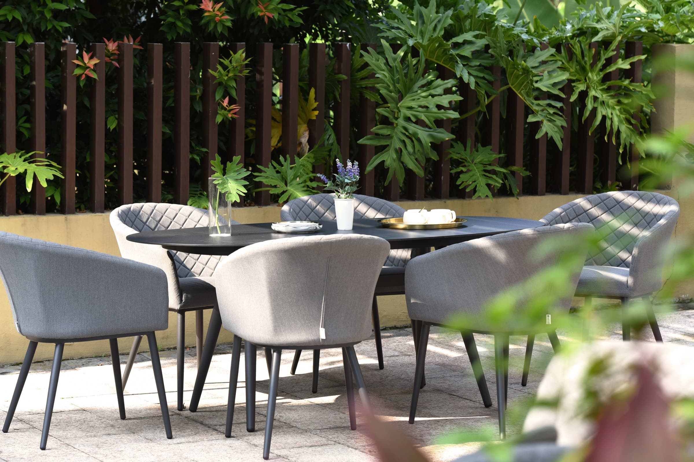 Outdoor dining furniture arranged on a hotel terrace