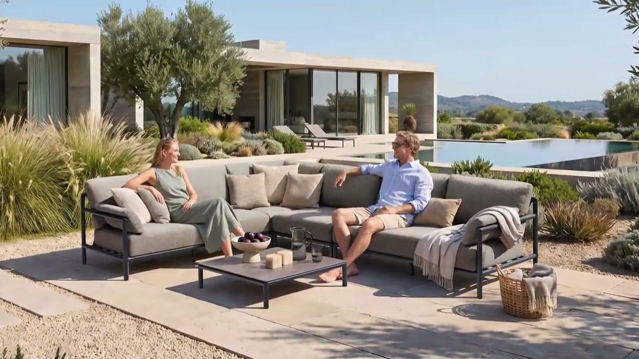 Outdoor lounge seating surrounded by lush garden planting
