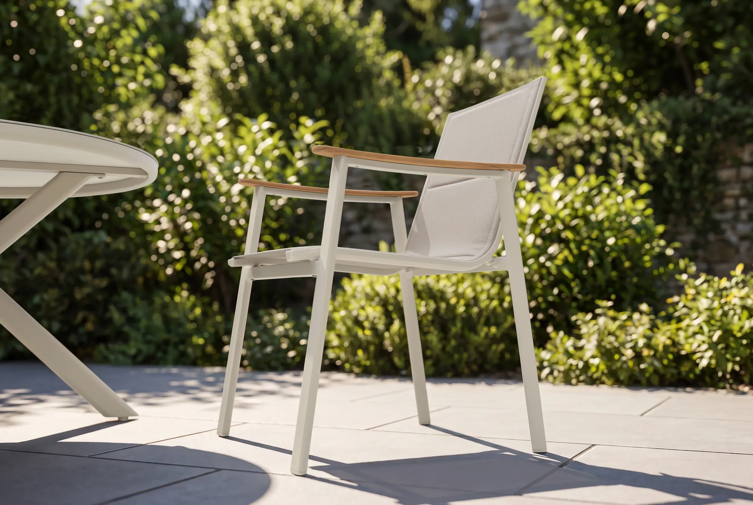 Breeze Dining Chair shown in an outdoor setting